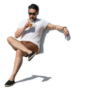 cut out asian man sitting and drinking juice