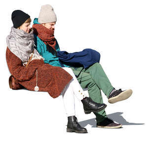 man and woman sitting on a bench