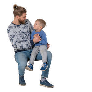 cut out little boy sitting on his fathers knee