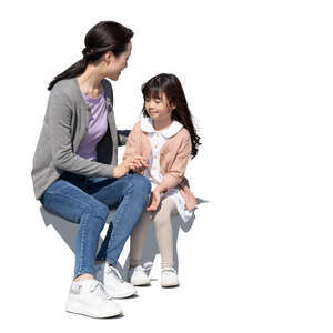 cut out asian mother and daughter sitting and talking