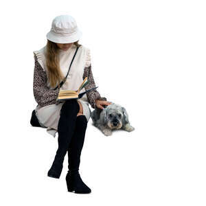 cut out woman with a dog sitting and reading a book