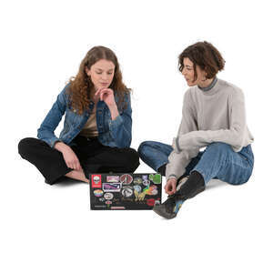 two cut out young women sitting on the ground and talking