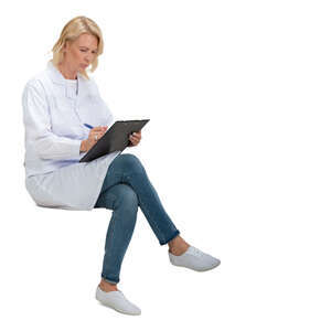 cut out female doctor sitting and writing