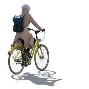 cut out backlit woman in spring overcoat riding a bike