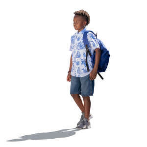 little backlit boy with a backpack walking