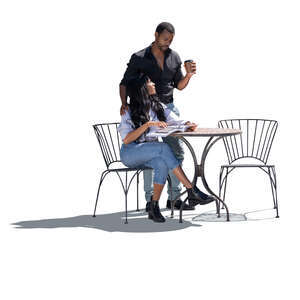 cut out black backlit couple sitting outside at a table and talking