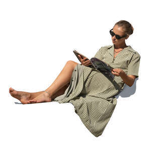 cut out woman sitting on reclining chair and reading a magazine