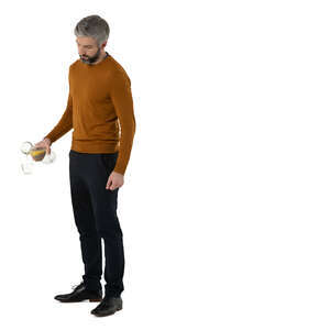 cut out man standing at a buffet table and pouring water into glass