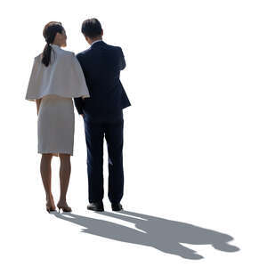 cut out backlit asian couple standing arm in arm