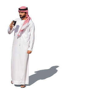 cut ot arab man in traditional emirati clothes standing and drinking coffee