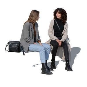 two cut out women sitting and talking