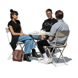 cut out group of three young people sitting in a street cafe