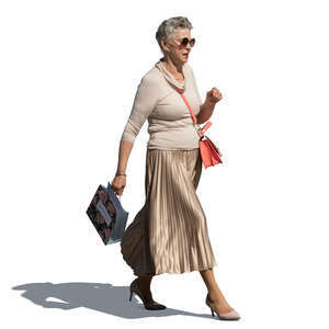 cut out elderly lady with a small shopping bag walking