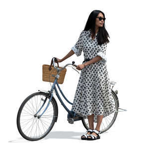 cut out asian woman in a summer dress standing and holding a bicycle