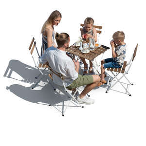 cut out family sitting in an outdoor restaurant seen from above