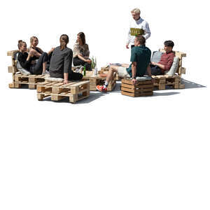 cut out group of young people relaxing in an outdoor cafe