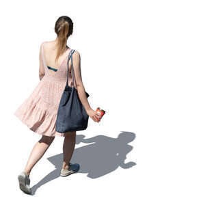 cut out top view of a woman in a pink summer dress walking