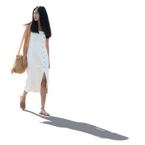 cut out backlit asian woman in a white dress walking