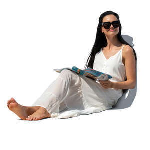 cut out woman in a casual white sitting on a sofa and reading a magazine