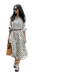 cut out asian woman in a dotted summer dress walking