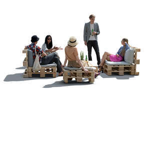 cut out group of young people hanging in a cafe with pallet furniture