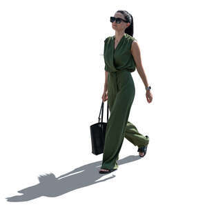 cut out backlit woman in a green jumpsuit walking