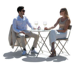 cut out elegant backlit man and woman sitting in a street cafe