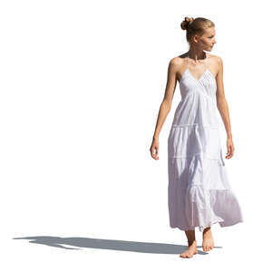 cut out woman in a white summer dress walking barefoot