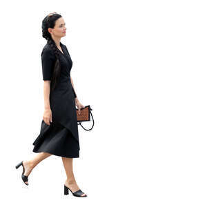 cut out woman in a chic black dress walking