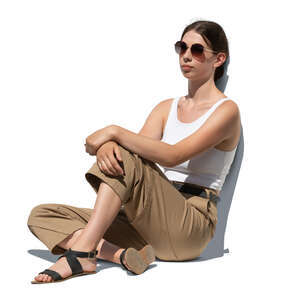 cut out young woman sitting on the ground