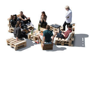 cut out group of friends sitting on pallet garden furniture