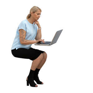 cut out woman sitting at a table and working with caomputer
