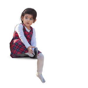 cut out little girl sitting and taking off her shoes