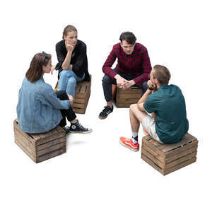 cut out top view of four young people sitting on wooden boxes