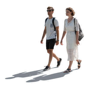 two cut out backlit people walking in summertime