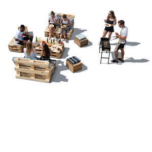 cut out group of young people having a barbeque party seen from above