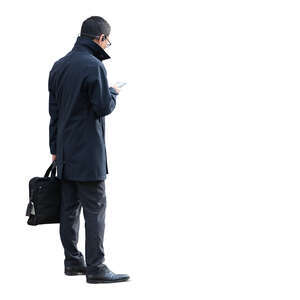 cut out businessman in a black overcoat standing