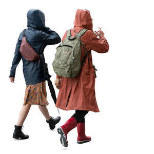 two cut out women wearing raincoats walking