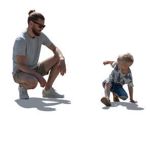 cut out backlit father and son playing