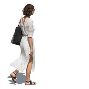 cut out woman in a white summer dress walking