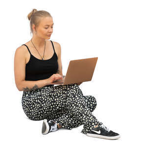 cut out woman with a laptop sitting on the ground