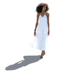 cut out backlit woman in a white summer dress walking