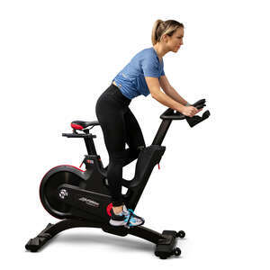 cut out woman exercising on spinning bike