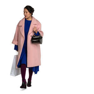 cut out asian woman in a pink overcoat walking