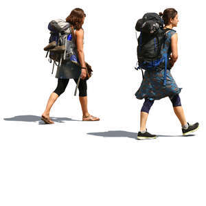 two women with huge backpacks walking on the road