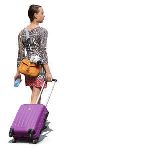 woman with a purple suitcase walking on the street