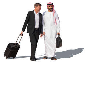 businessman and emirati man with suitcases walking