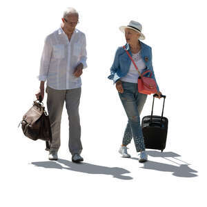 cut out backlit elderly man and woman with travel bags walking