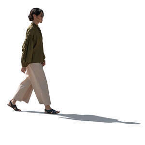 cut out backlit young asian woman walking