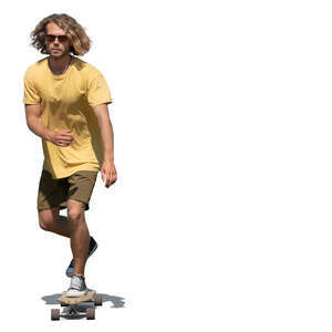 young man with curly hair riding a skateboard